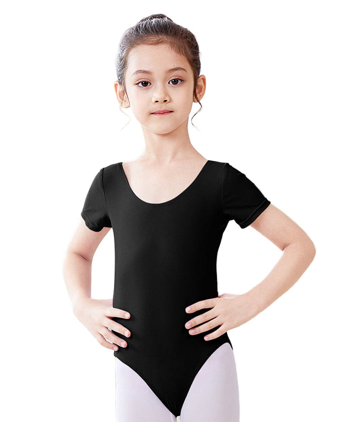 Young girl wearing a black leotard on a white background