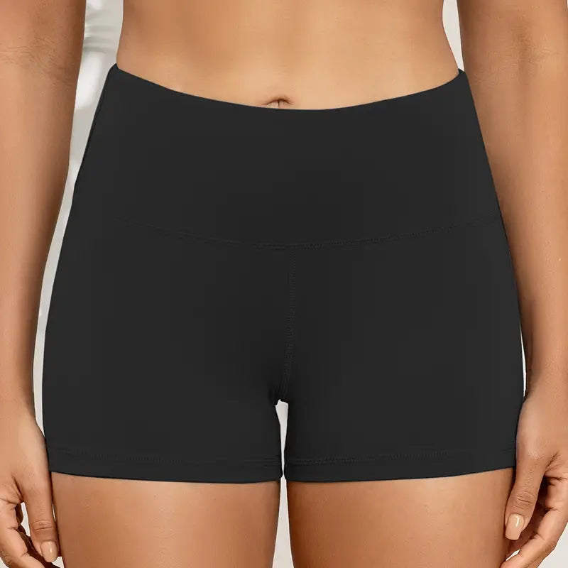 Black shorts worn by a person on a neutral background
