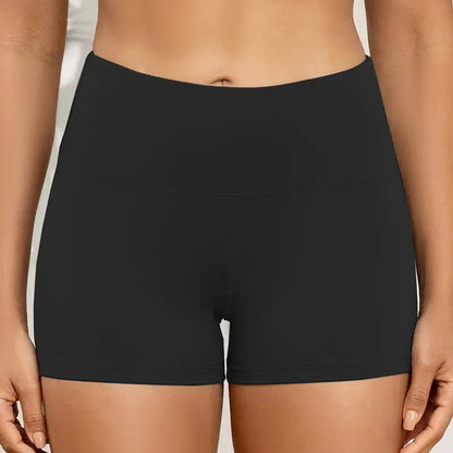 Black shorts worn by a person on a neutral background