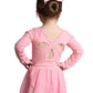 Child wearing a pink dress with cut-out back design on a white background